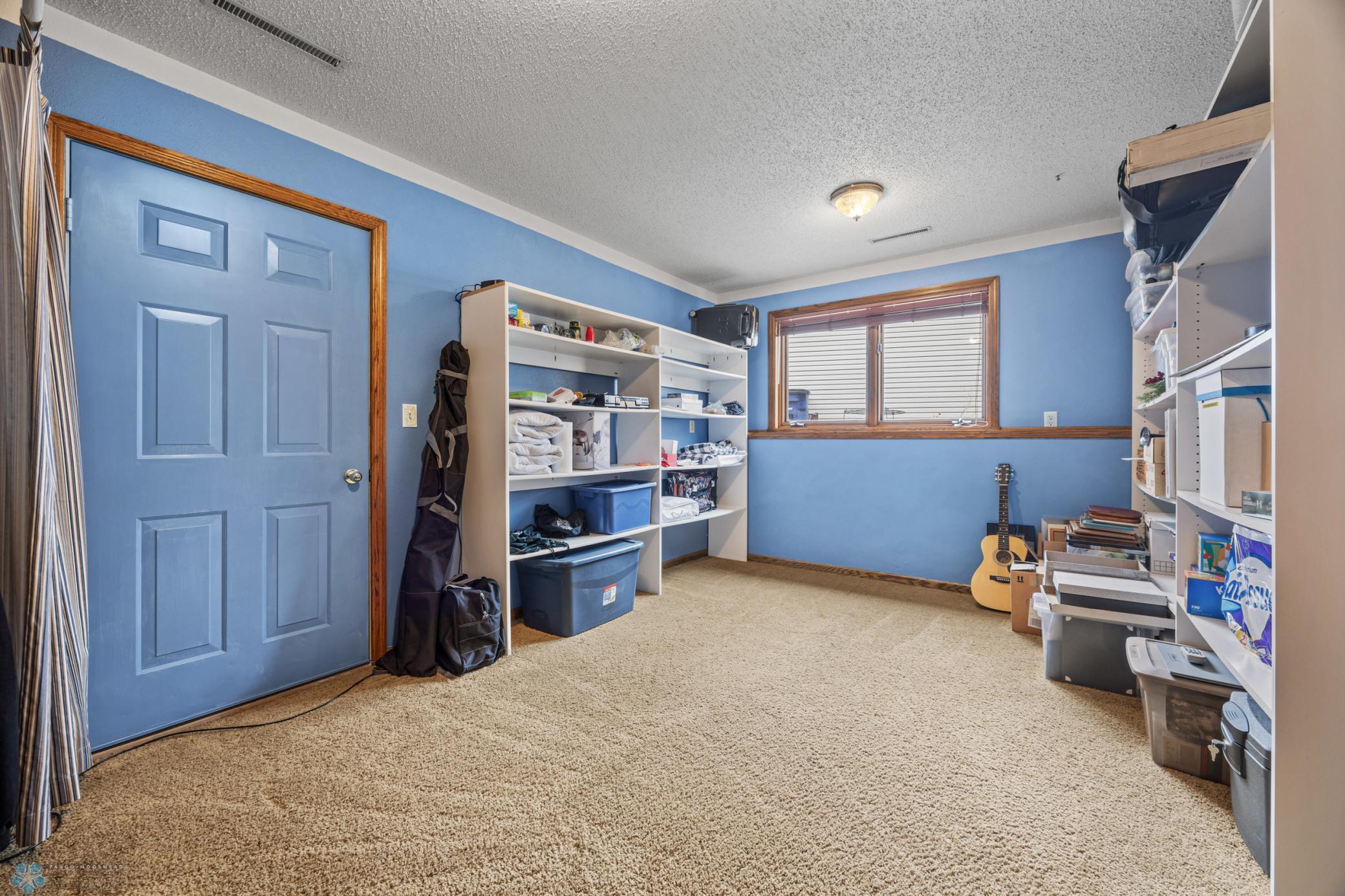Lower Level 4th Bedroom - has doorway to garage-access stairs