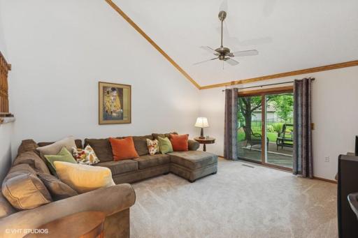 Vaulted main floor family room w/patio doors to deck.