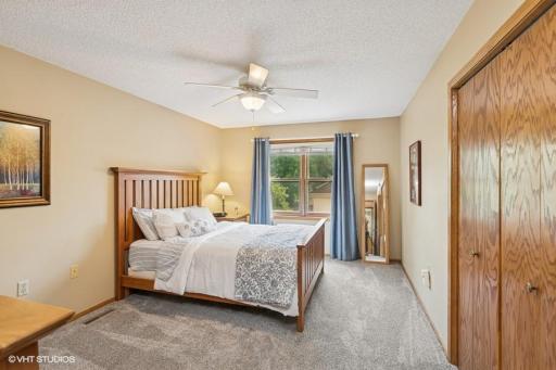 Very spacious primary bedroom with window overlooking the front yard,
