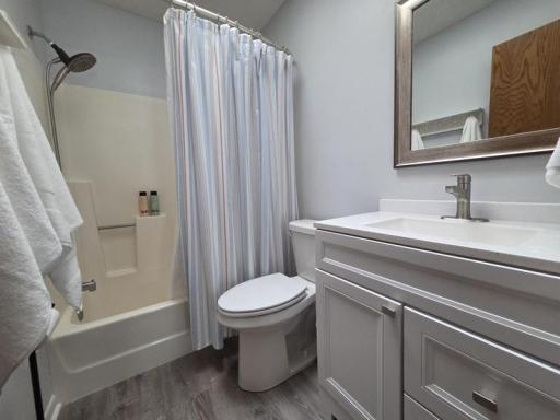 Updated full bath with skylight & laundry chute.