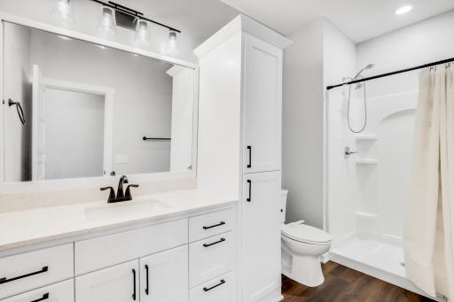 A 3/4 bath serves the lower-level entertainment areas and the 4th bedroom.