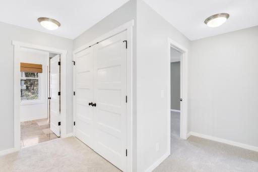 The upper level boasts a magnificent owner's suite, 2 additional bedrooms, full bathroom and a well-appointed laundry room.