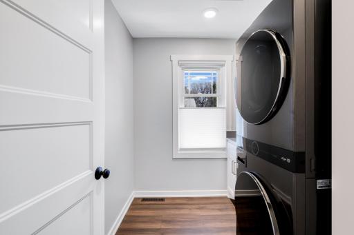 The laundry room features LG appliances, a sink and folding counter.