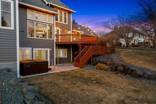 The beautiful paver patio and spacious deck are perfect for entertaining.