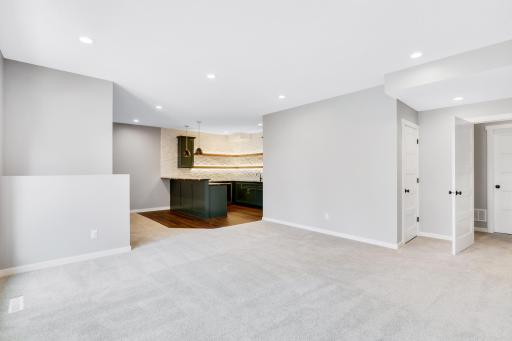 The walkout lower level is open and designed for exercise, fun and entertainment.