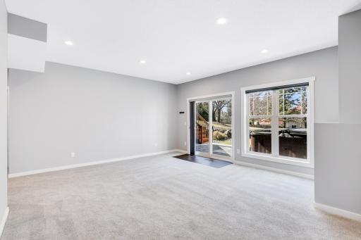 The family room walks out to a spacious paver patio in the fully fenced backyard.