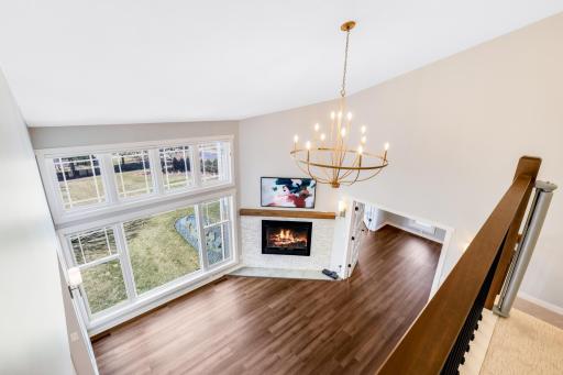 The upper-level hallway overlooks the main-floor living room.
