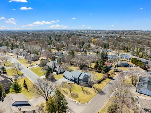 The home is set on a premium, 2/3 of an acre lot in a quiet, mature, walkable neighborhood, one minute from 35E.