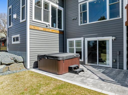 The beautiful paver patio and spacious deck are perfect for entertaining.