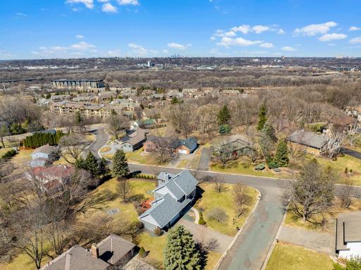 The home is set on a premium, 2/3 of an acre lot in a quiet, mature, walkable neighborhood, one minute from 35E.