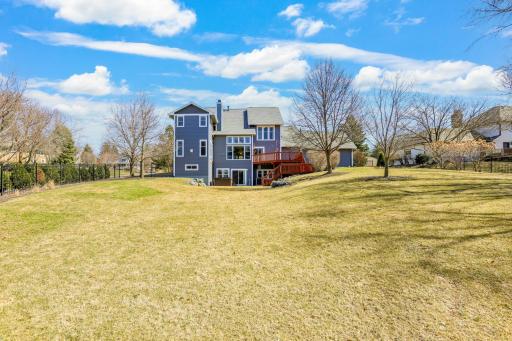 The backyard is massive and ready for outdoor activities.