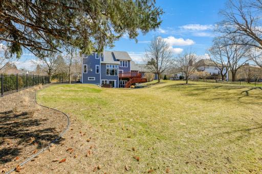 The backyard is massive and ready for outdoor activities.