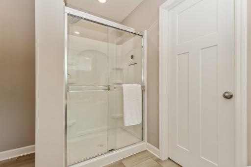 In addition to the soaking tub, the primary bath also has a separate shower.