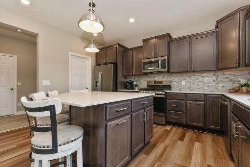 Stainless steel appliances, center island, granite counters, tile backsplash...so much to love here!