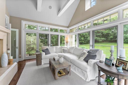Vaulted ceilings greet you in this perfect sunroom!