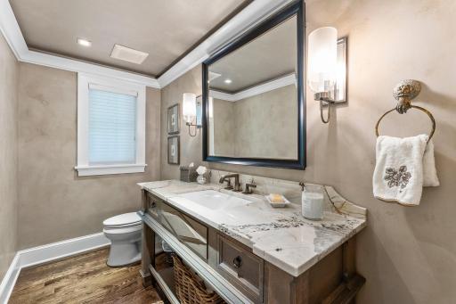 Half bath with large vanity just off the front entrance!