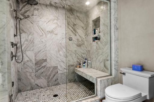 Mosaic tiles line the walk-in steam shower!