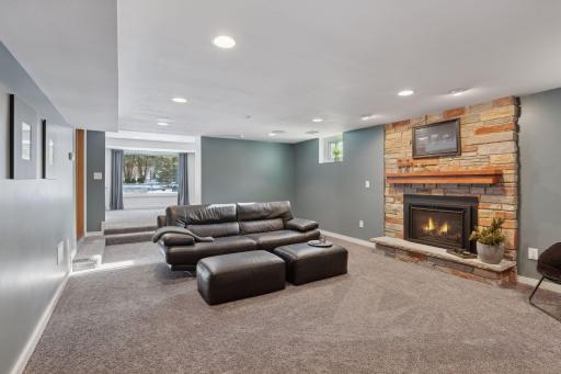 Cozy up to the fireplace and watch a movie in the lower family room