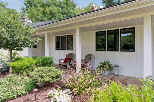 Enjoy the covered front porch overlooking the front yard