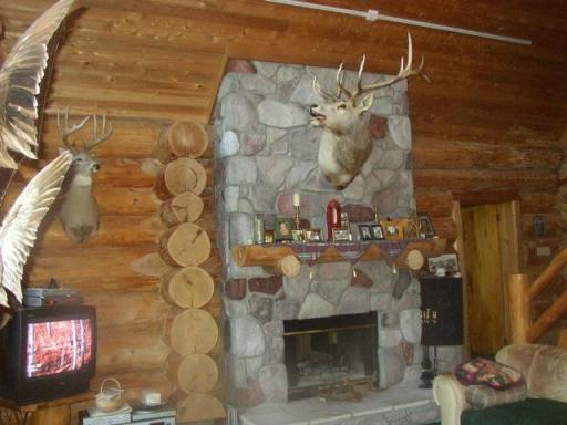 Photo for 2450 Keyes Island, International Falls, MN 56649 - Listing #6691973 Custom wood burning rock fireplace. Take the chill off and makes for a cozy room.