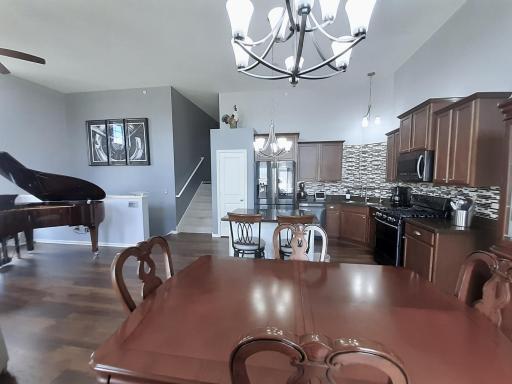 Informal dining area shown with a large dining set and hutch