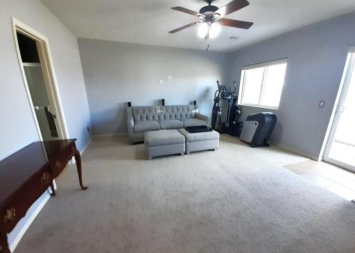 LL Family room with large windows and patio door