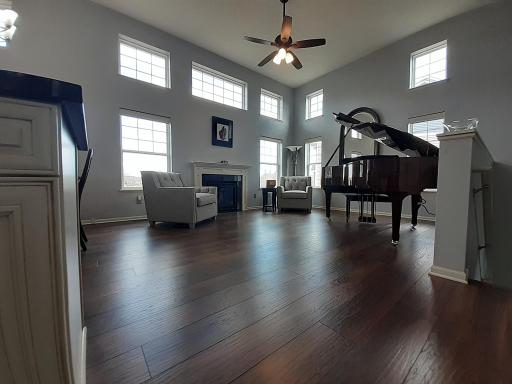 Gorgeous hand-scraped engineered hardwood flooring throughout