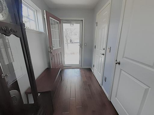 Private entry area with garage access door & closet shown. Just behind you, 1/2 flight of stairs either up or down