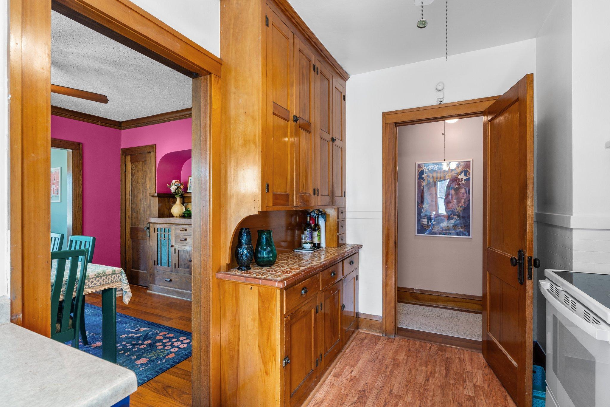 Floor-to-ceiling kitchen cabinet storage.