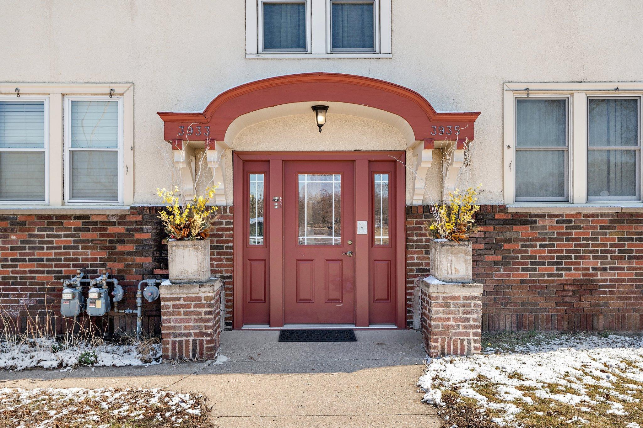An inviting and charming front entrance. A lovely Brick and Stucco exterior
