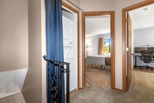 Washer and dry are close to the bedrooms.