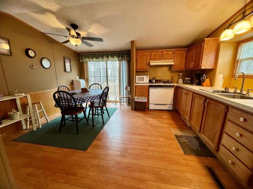 Kitchen/Dining room with patio door that leads to a second deck