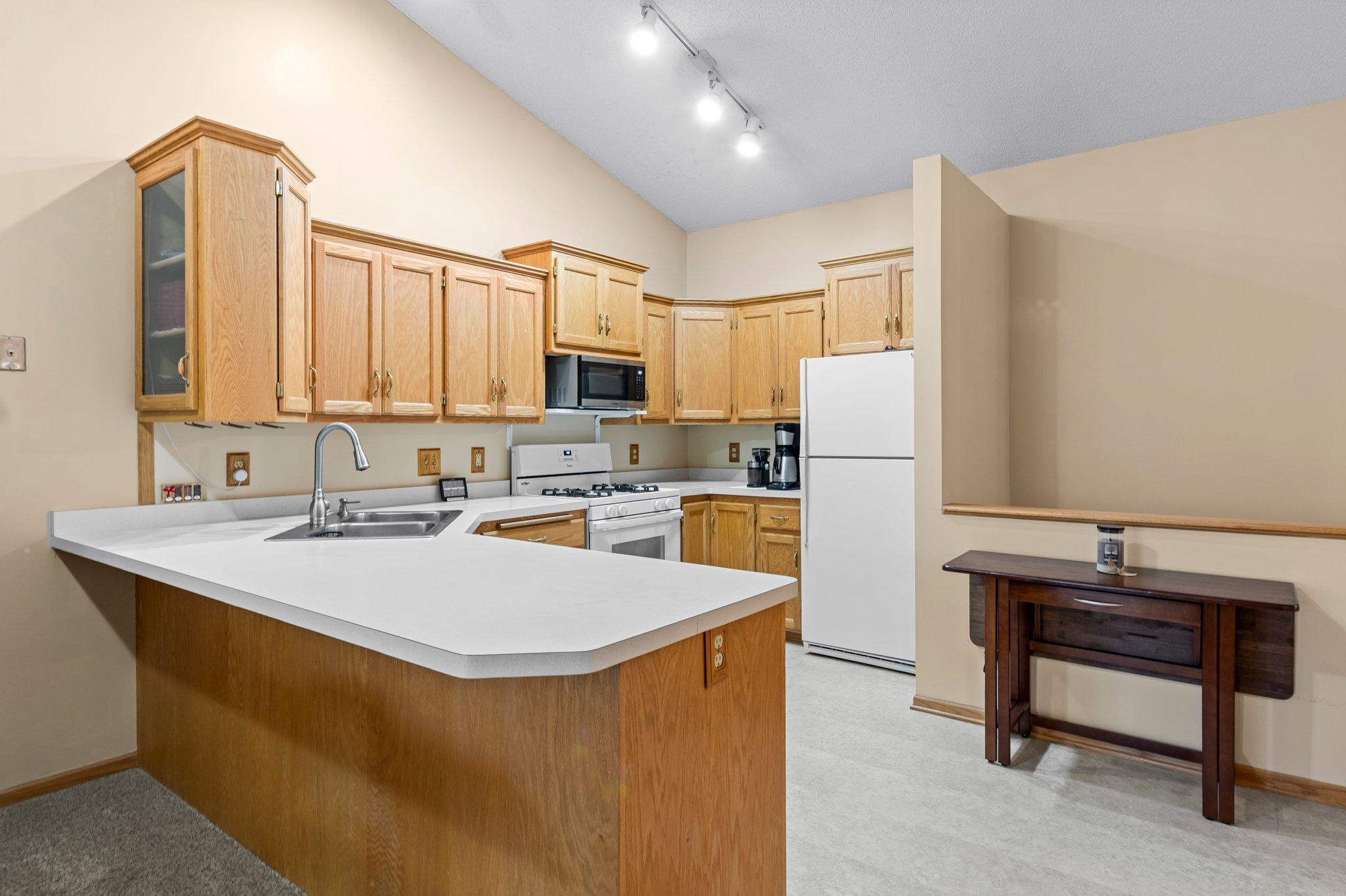 Vaulted kitchen has space to work in 6318_Cavell_Ct-97.jpg