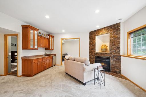 Lower level family room with cozy gas fireplace