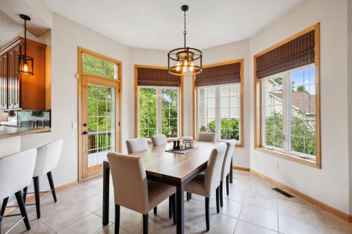 Love this nook for your table with tons of windows and access to the backyard