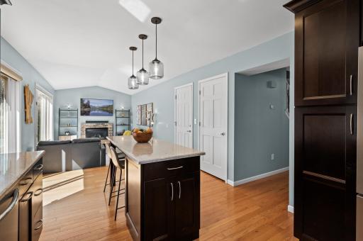 Well thought out storage, including an island cabinet and good pantry space around the fridge