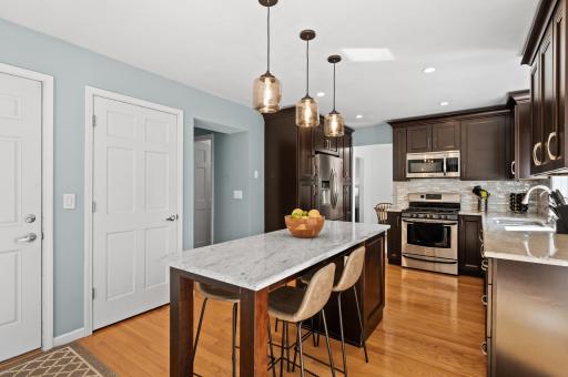 Gorgeous recently updated with thoughtfully designed cabinetry storage, including an island cabinet and good pantry space around the fridge