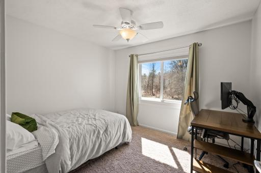 Bright, upstairs 3rd bedroom has views of trees in back