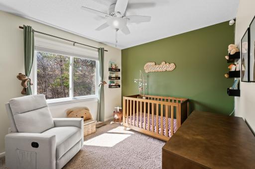 One of 3 Bedrooms up - bright and sunny with overlooking trees in he back
