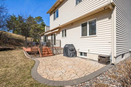 Attractive paver patio for grilling and extra area for hosting