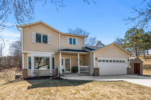 Welcome to 2402 Leyland Trail! In one of the prettiest neighborhoods in Woodbury, this home sits on an end lot on a treelined street in the Colby Lake neighborhood. The private pool and tennis courts are practically across the street.