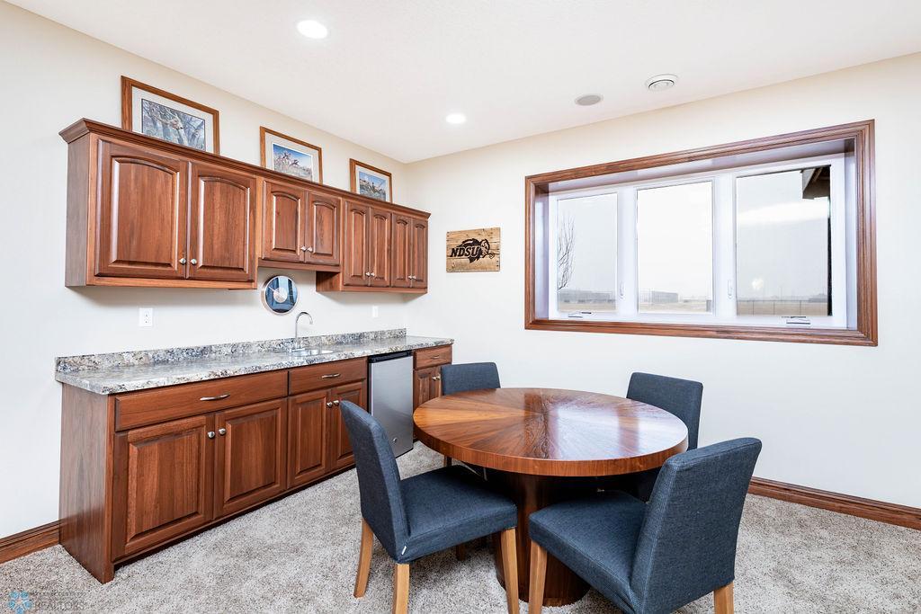 Basement wet bar. Lots of light from egress window.
