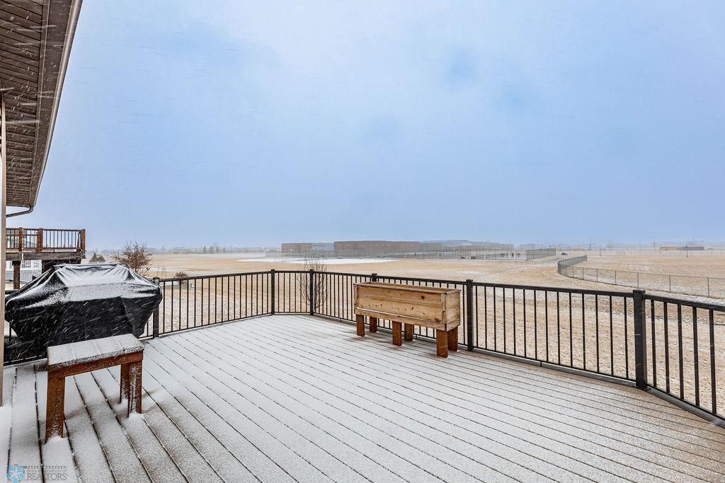 Large deck overlooking backyard