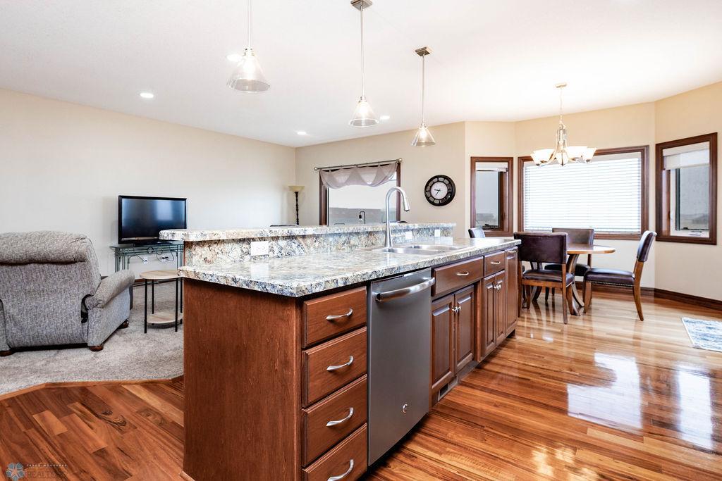 Center island with pendant lighting & seating for 4