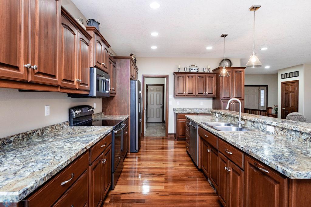 Gorgeous Tigerwood floors. Tons of cabinets. Lots of counterspace. S/S appliances. Large island.