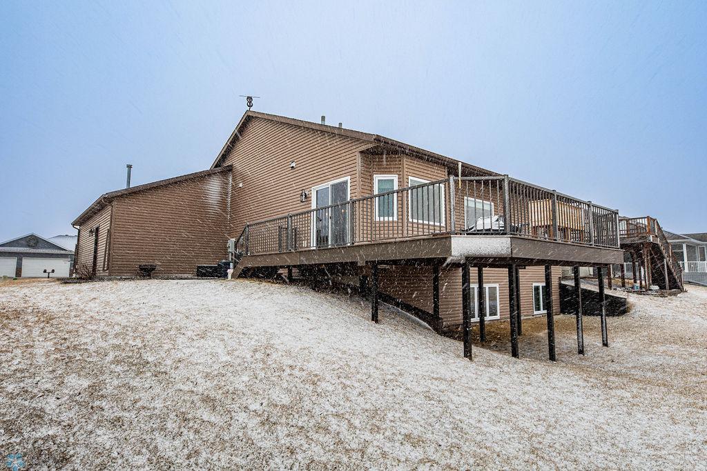 Maintenance free deck wraps around to a patio