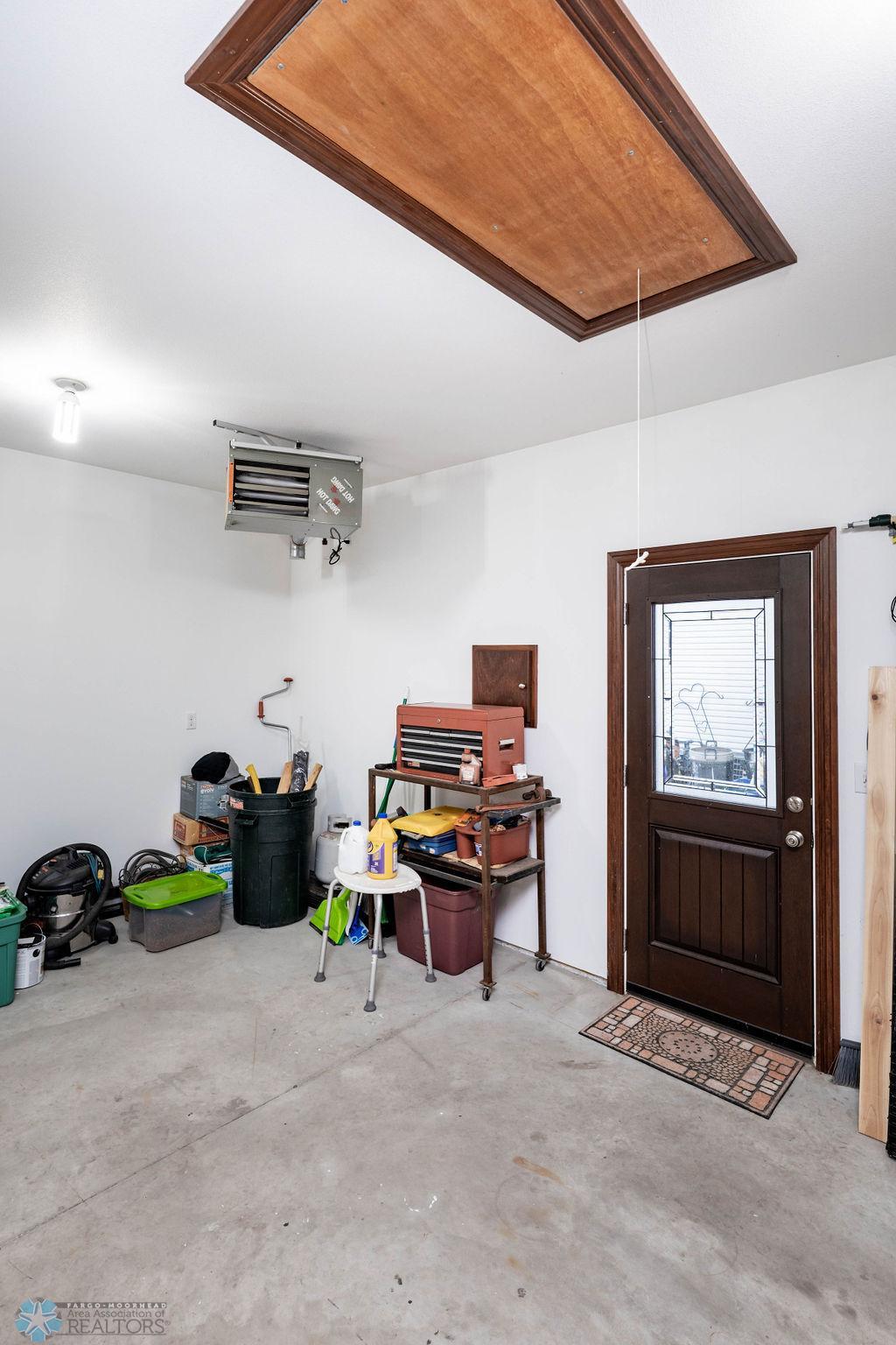 Door to side yard with access to wraparound deck