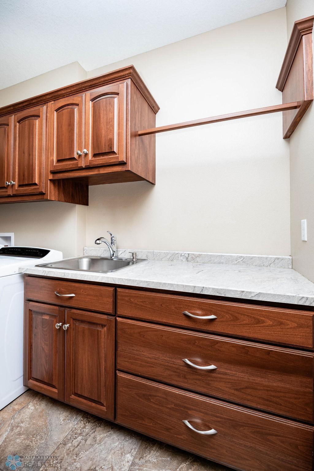 Utility sink. Storage. Hanging bar.