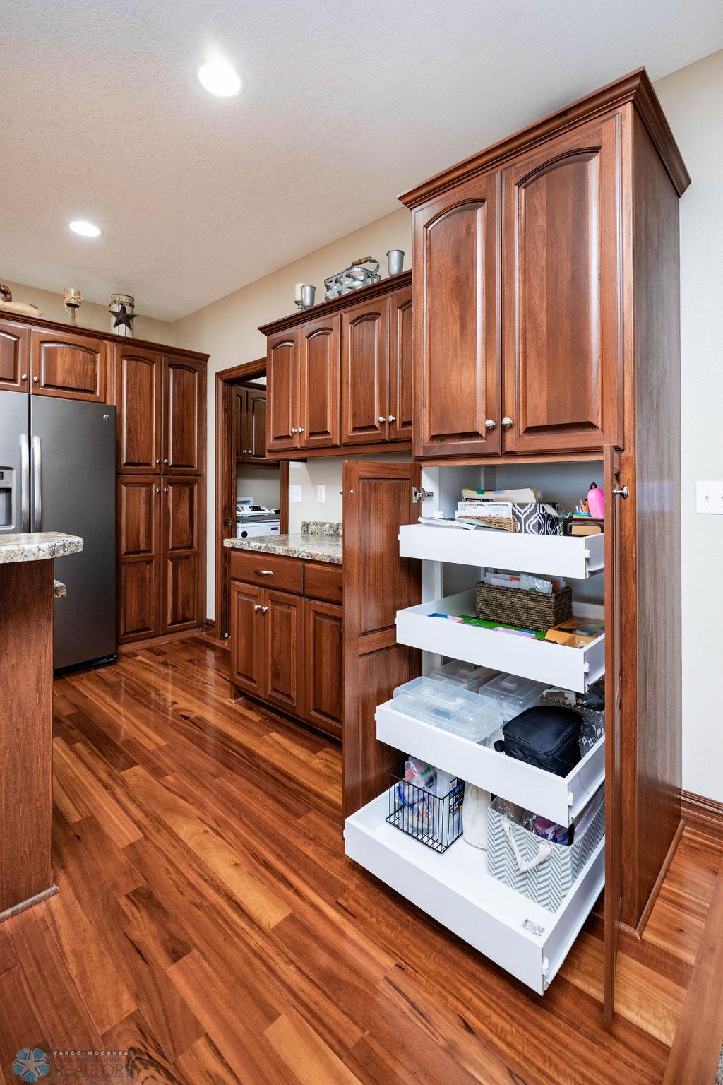 Pull-out drawers in cabinets offer convenient storage & accessibility!