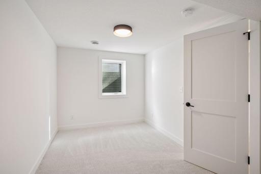 The finished lower level includes a flex space, guest suite with 5th bedroom, and a beautiful tiled bathâideal for movie nights, a home gym, or weekend guests.